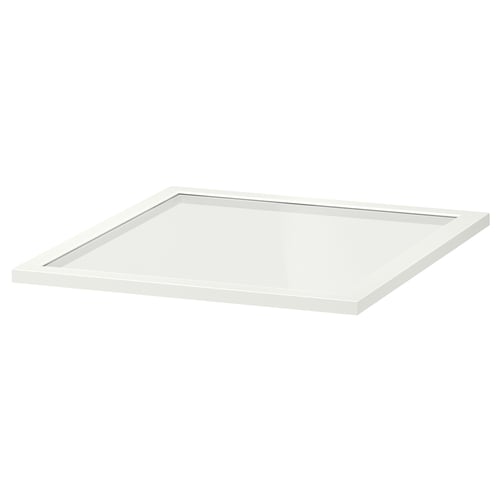 A KOMPLEMENT glass shelf, white, rectangular, with a clear glass panel framed by white fibreboard.
