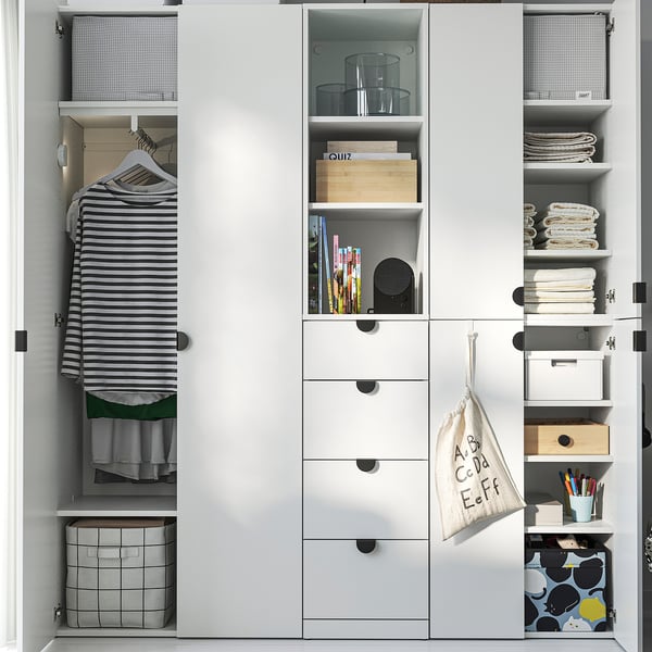A well-organized closet with hanging clothes, shelves with storage boxes, books, and kitchenware. Adjustable feet ensure stability.