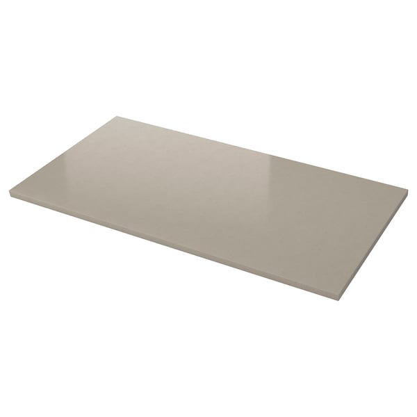 A LOCKEBO rectangular glass composite kitchen worktop, beige, smooth, and reflecting light.