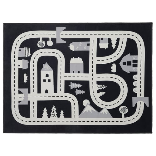 Black and white play rug with roads, houses, and trees. Circular and rectangular shapes, made from recycled polyester.