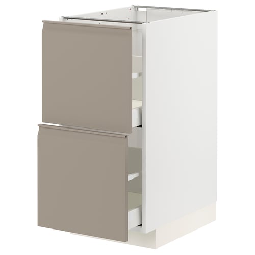 A modern, beige ikea METOD kitchen cabinet with integrated handles, featuring smooth-running drawers.