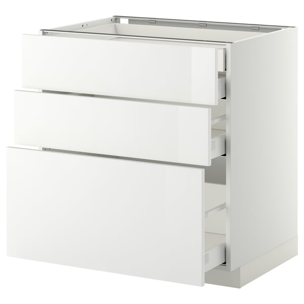 A white METOD kitchen cabinet with three drawers. The cabinet a high gloss finish and sleek design. The drawers are self-closing and run smoothly.