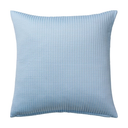 A square light blue NJÅSATS pillow with textured waffle design, made from recycled materials.