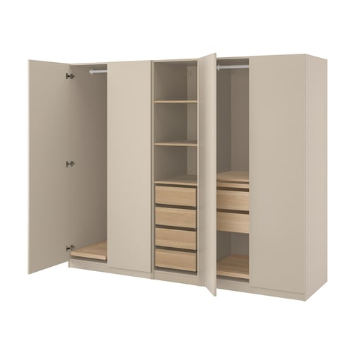 An open beige PAX wardrobe with shelves and drawers.