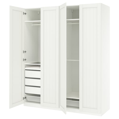 An open white PAX wardrobe with shelves and drawers.