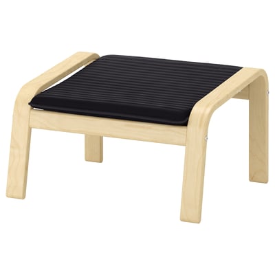 Black cushioned wooden stool with curved legs. Modern minimalist footrest, lightwood and dark cushion.