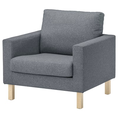 Grey upholstered armchair, wooden legs, modern design.