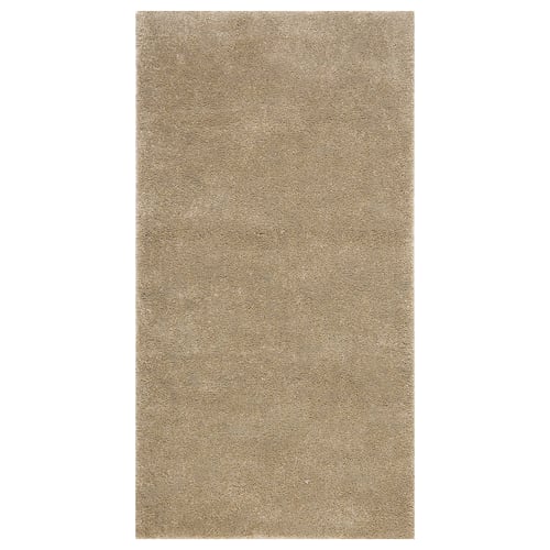 STOENSE rug, neutral beige, soft textured pile, rectangular, minimalist design.