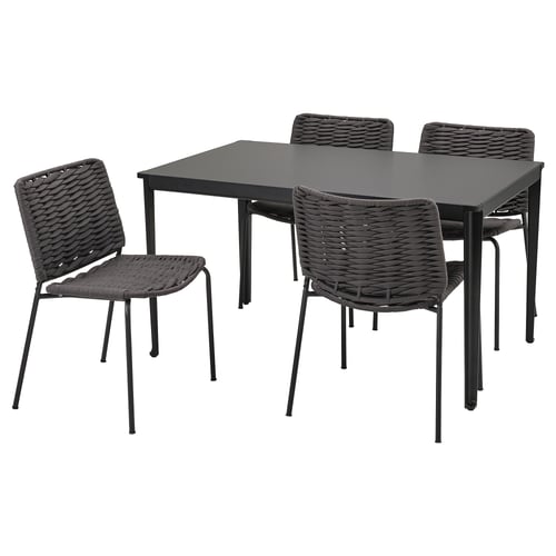 Grey outdoor furniture set with glass table and woven chairs.