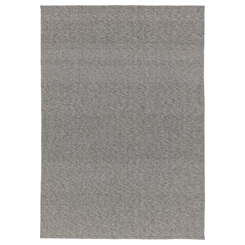 A TIPHEDE rug in grey, rectangular, with a woven cotton design. Perfect for living rooms or under dining tables.