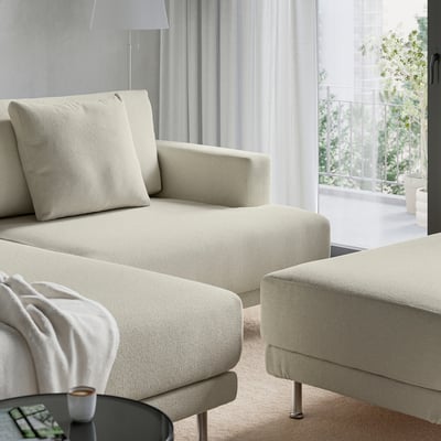 Modern cream-sectional sofa with large cushions and metal legs for airy look and easy cleaning.