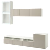 Ikea BESTÅ bela in bež TV enota s policami in omarami.