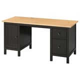Ikea HEMNES miza v črno-rjavi barvi s svetlo lesenim vrhom. Ima omarico z vrati in predali na desni.