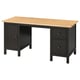Ikea HEMNES miza v črno-rjavi barvi s svetlo lesenim vrhom. Ima omarico z vrati in predali na desni.