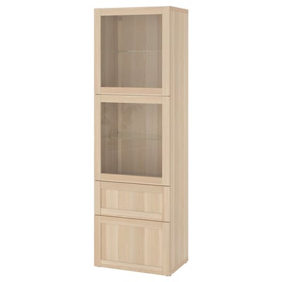 Svetlobéžová úložná skrinka IKEA BESTÅ so sklenenými dvierkami a zásuvkami.