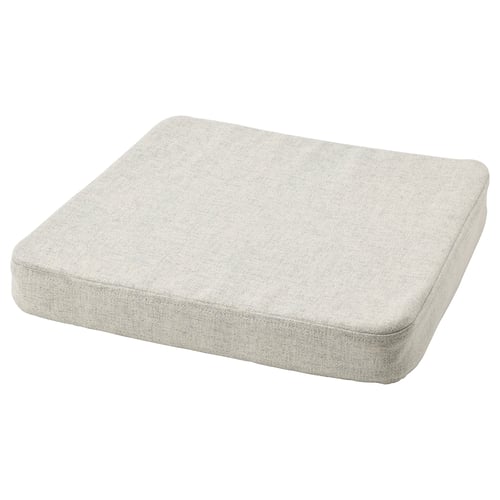 A beige ÅKERVINDEFLY chair pad with a rectangular shape and memory foam filling for comfort. Its non-slip back ensures stability.