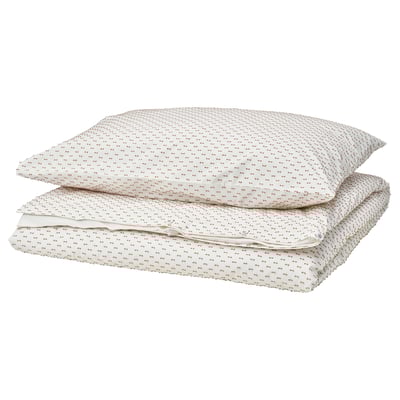 A neatly folded white BANDKNIPPE duvet cover set with beige woven details, made from 100% cotton.