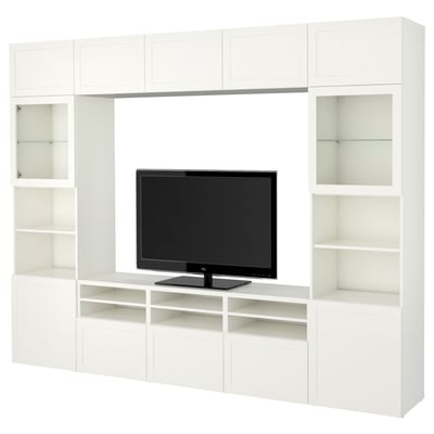 White BESTÅ tv unit with cabinet, glass doors, and adjustable shelves.