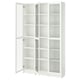 A white BILLY bookcase with glass doors. It adjustable shelves and a sleek design.