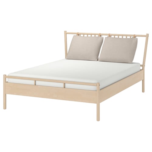 BJÖRKSNÄS bed in beige, light wood, rectangular, minimalist design with two pillows.