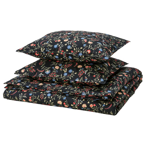Black bedding set with floral pattern on dark background, rectangular with square pillows, made of organic cotton.