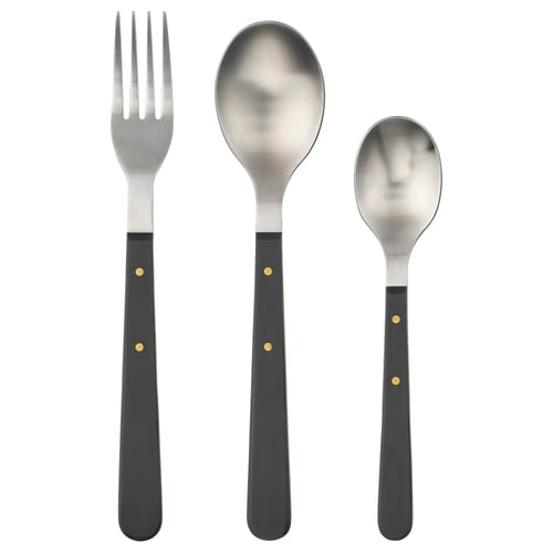 Elegant DOFTSKÖLD cutlery set in black, featuring gold details. Includes fork, large spoon, and small spoon, all in sleek, stainless steel design.