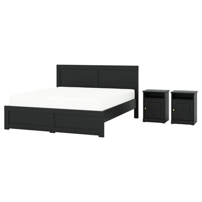 Black wooden bed with matching nightstands, sleek modern design.