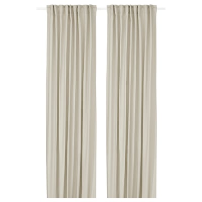 Two beige GINSTMOTT curtains hang straight, with rod pocket design, durable and eco-friendly, providing dim light and privacy.
