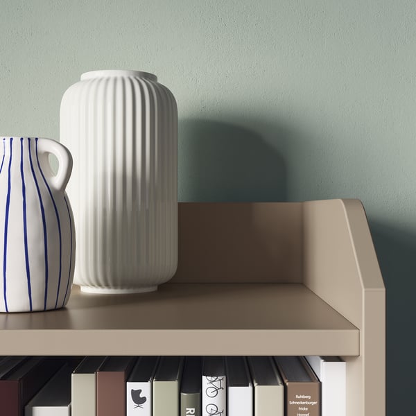 Modern shelving with vases and books.