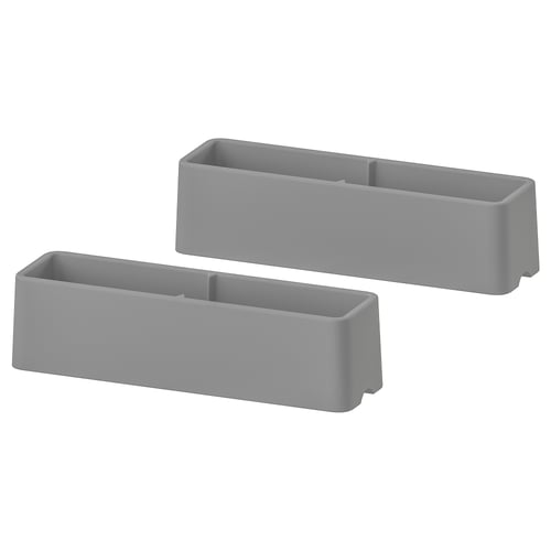 Two grey rectangular plastic furniture guards.
