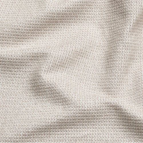 Close-up of textured, two-tone fabric, soft and lustrous, made from recycled materials.