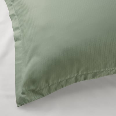 Fresh green pillowcase, smooth texture, elegant flange.