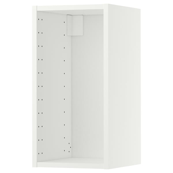 A white METOD wall cabinet from IKEA. Its rectangular with a smooth design, featuring multiple holes on one side for adjustable shelving.