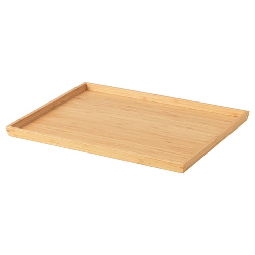 An empty rectangular bamboo tray with a light brown colour. Its simple and flat, ideal for serving.
