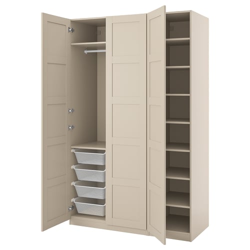 An open beige PAX wardrobe with organiser baskets and shelves.