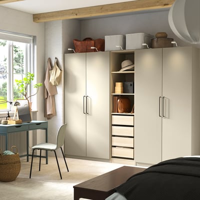 Beige PAX wardrobe with shelves, desk, chair, minimalist.