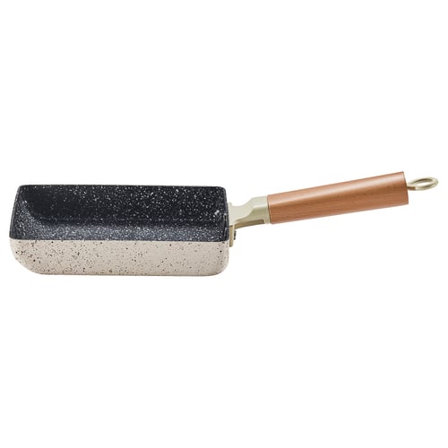 The PUCKELLAX small frying pan. Its black and white, rectangular, with a wooden handle, ideal for cooking tamagoyaki or frying.