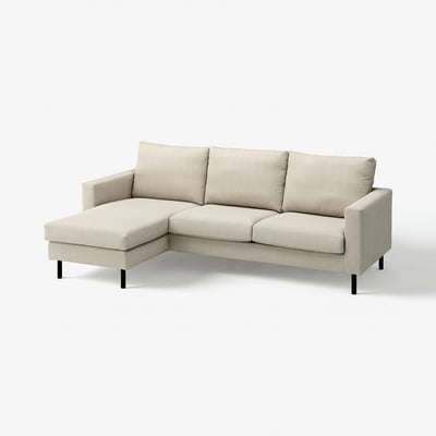 A beige-colored SALTSJÖBADEN sectional sofa with a chaise longue, showcasing a clean and modern design with comfortable cushions and metal legs.