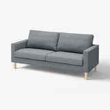 A modern grey SALTSJÖBADEN sofa with wooden legs, a sleek design, and a cosy appearance.