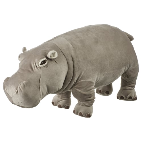 Grey stuffed hippo toy standing on four legs with a round face and large ears. Soft and plush, perfect for cuddling or play.
