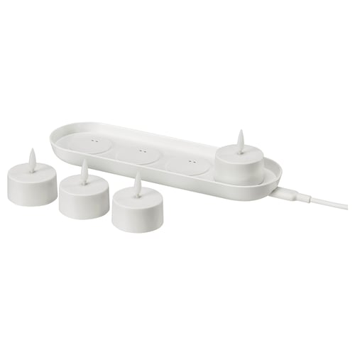 SKATGÅS led tealight kit. White, includes 4 tealights and charging tray. Safe, flickering lights for homes ambiance.