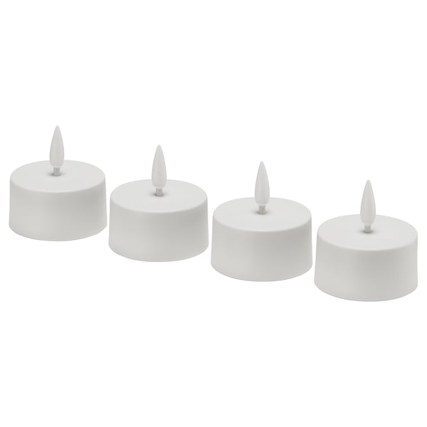 Four white, cylindrical led tealights in a row. Minimalist design, no flicker. Each has a pointed wick. Ideal for decorative lighting.
