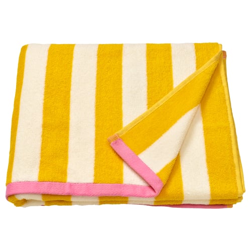 A SLÅNHÖSTMAL towel, yellow and white striped, with pink trim, folded neatly. Made from 100% cotton.