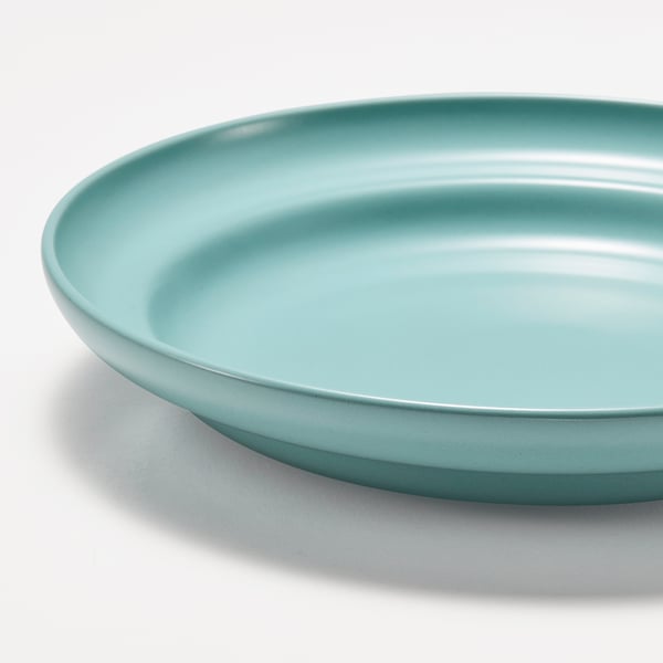 A large, light blue, shallow dish. Smooth finish, wide rim, sits evenly on a flat surface.
