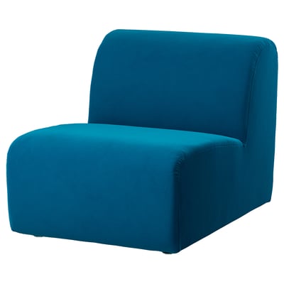 Displays a blue STOCKHOLM 2025 sofa with a modern, minimalist design featuring a rounded shape and deep cushions.