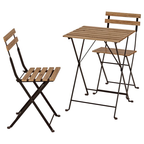 A TÄRNÖ outdoor set with a natural wood and black metal foldable chair and a square table.
