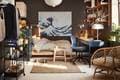 moody brown bedroom with blue desk and chair and open shelving on the wall