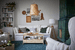 Scandinavian living room with white furniture and IKEA floor lamp with woven pendant light