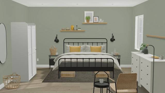 green bedroom idea with black bed and nightstands and floral bedding with yellow pillows