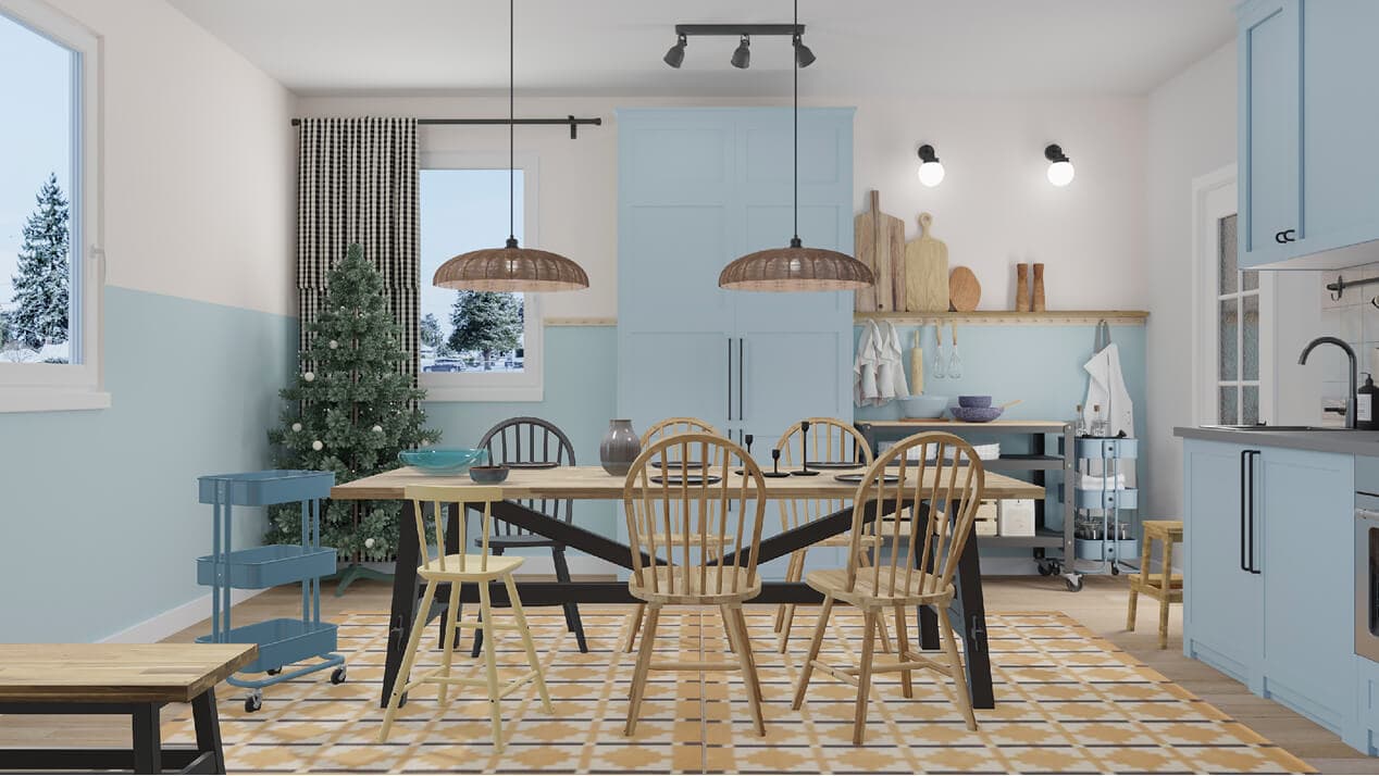 Virtual dining space with a wooden table, chairs, and a patterned rug beside a modern kitchen. A decorated VINTERFINT Christmas tree stands in the corner against light blue walls and cabinets.